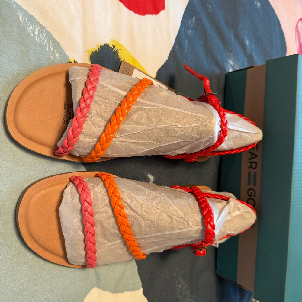 Toms Kira sandals in red, orange, and pink